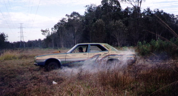 Jamie burning grass in burnout at the end of the day